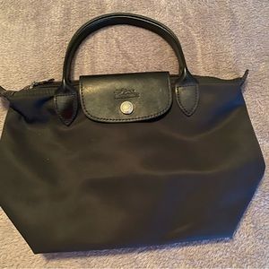 Black Longchamp bag.